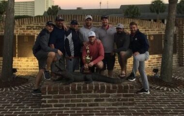 Eight male golfers posing for picture at Myrtle Beach