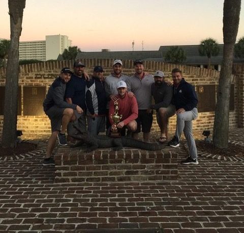 Eight male golfers posing for picture at Myrtle Beach