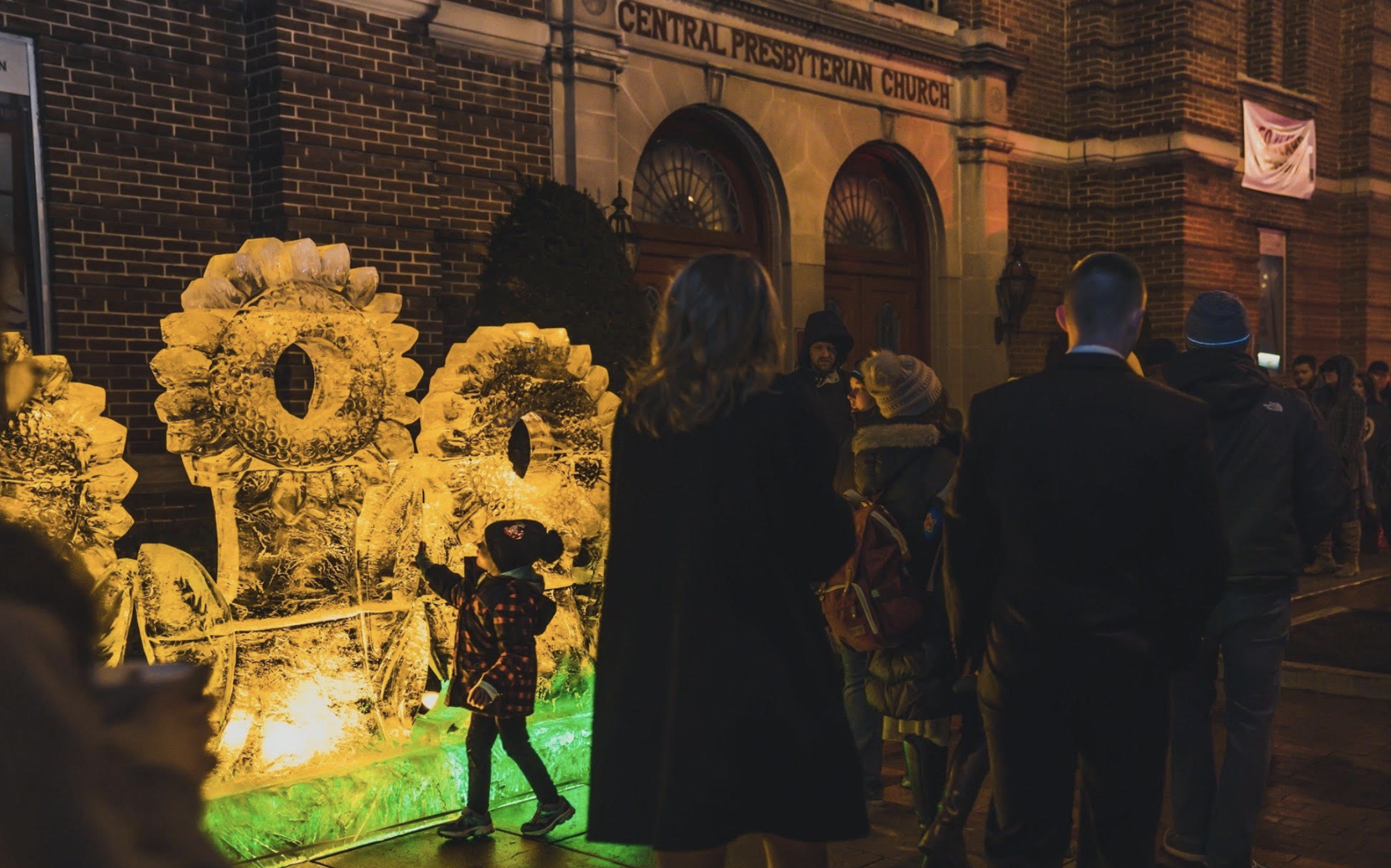 People attending the Icefest in Chambersburg, PA and standing outside the Central Presbyterian Church