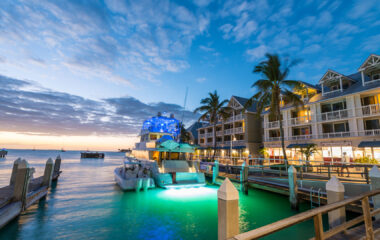 Pier on the port of Key West, Florida with boat docked by hotel