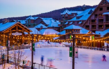 Outside view of Stowe Mountain Resort with hockey rink and Whistling Pig
