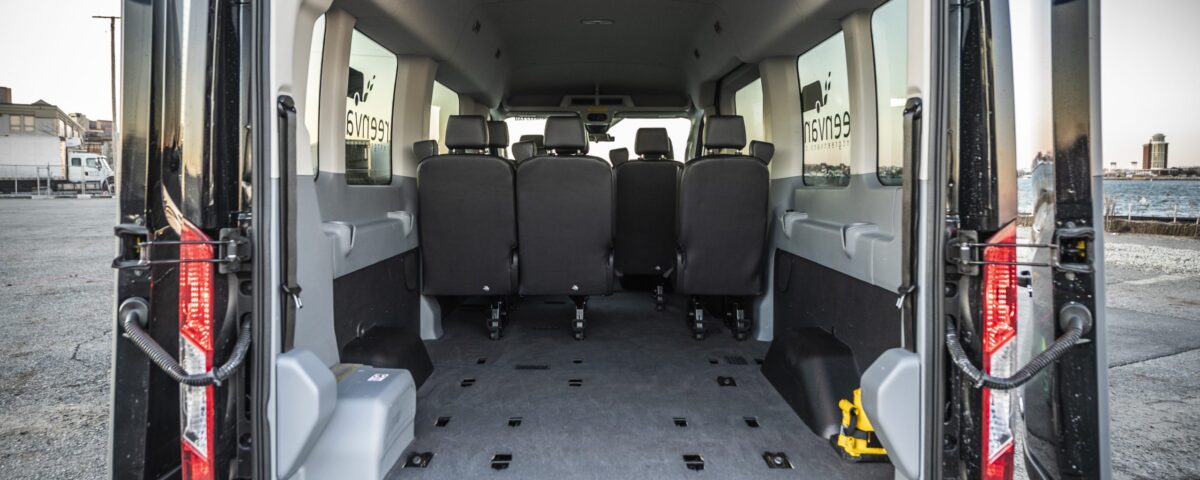 Interior view of rear of Ford 15 Passenger Medium Roof Transit 350 XLT with back two rows removed