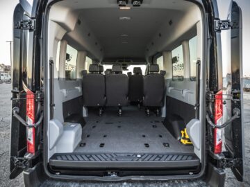Interior view of rear of Ford 15 Passenger Medium Roof Transit 350 XLT with back two rows removed