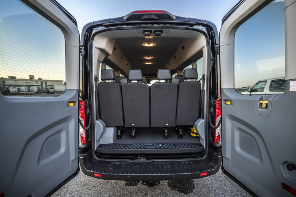 Back interior view of Ford 15 Passenger Medium Roof Transit 350 XLT with all four rows installed