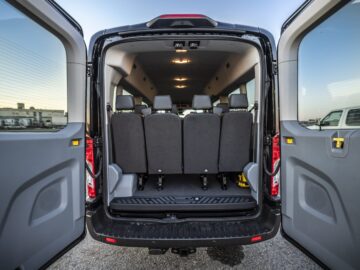 Back interior view of Ford 15 Passenger Medium Roof Transit 350 XLT with all four rows installed