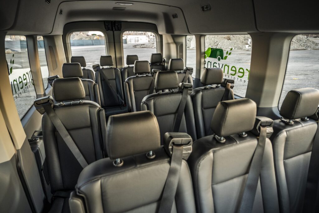 Interior view of Ford 15 Passenger Medium Roof Transit Rental Van with all four rows installed
