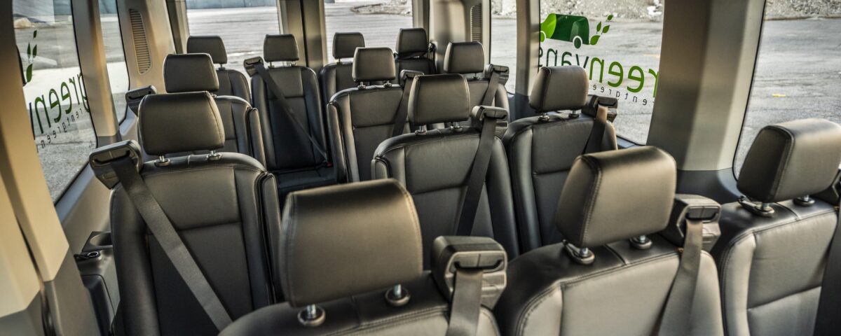 Interior view of Ford 15 Passenger Medium Roof Transit Rental Van with all four rows installed