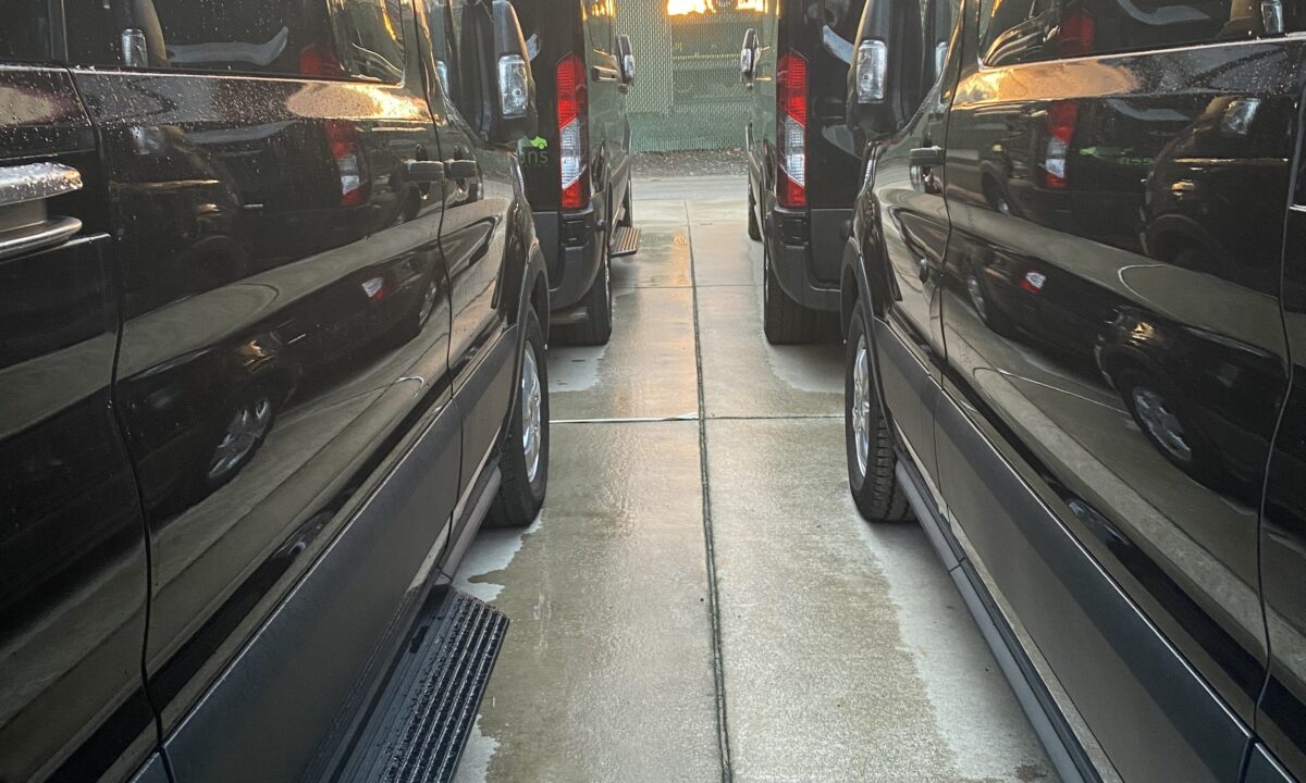 Rows of new 15 passenger Transit Rental vans from Greenvans in Philadelphia.