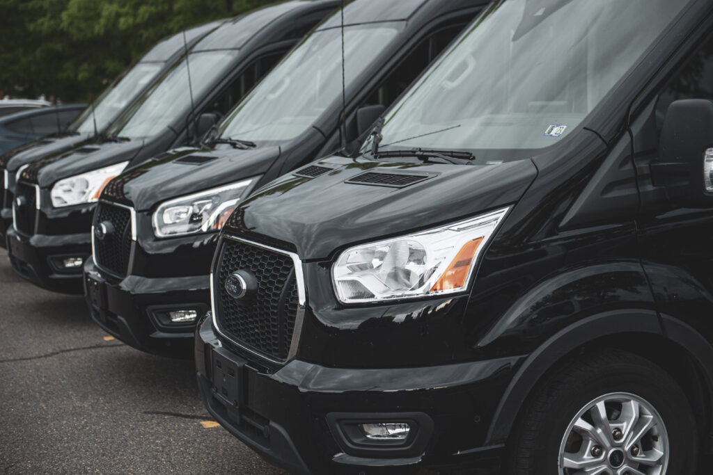 Greenvans 15 passenger van with company logo
