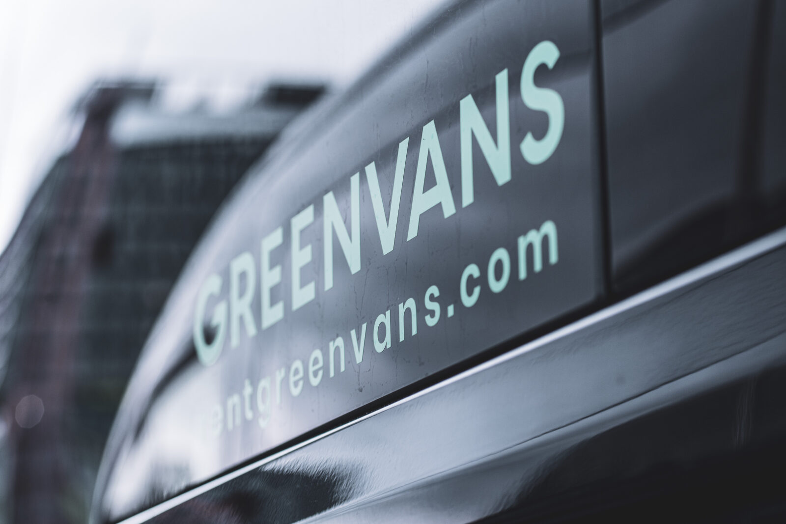 Greenvans 15 passenger van with company logo